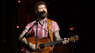 Image for Post Malone Falls Off Stage While Toasting With Fan During Arizona Show