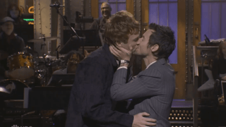 Image for Harry Styles Claps Back at Queerbaiting Criticism During ‘SNL’ Opening Monologue, Ends Segment With Male Kiss: ‘Now That’s Queerbaiting!’
