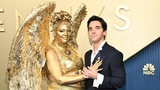 Image for Meg Stalter Shocks Emmys by Transforming Into a Golden Human Emmy on Red Carpet